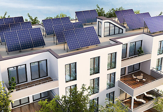 Bild mit heller Häuserreihe und Solaranlagen auf dem Dach